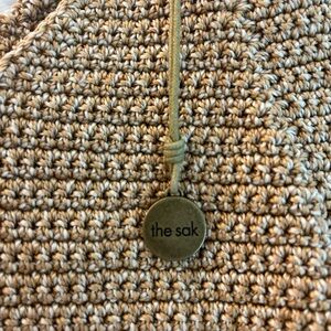 The Sak tan and white embroidered bag. NWOT.